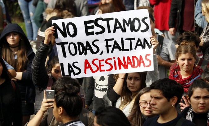 Activists take to the streets on the National Day Against Femicide, Chile, Dec. 19, 2020.The sign reads, 