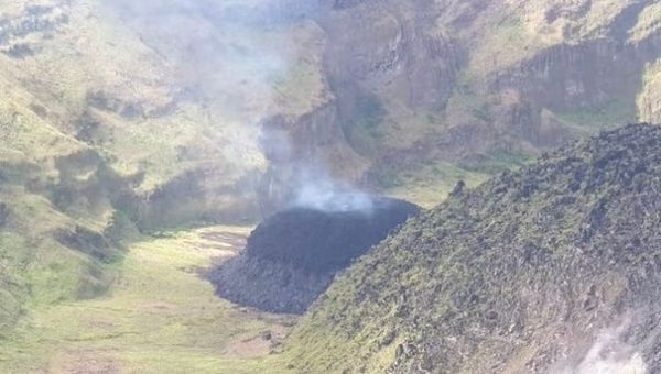A small lava dome with fresh magma can be seen here as a black mound at the base of the existing dome in the crater at La Soufriere volcano, Dec. 29, 2020. St. Vincent.