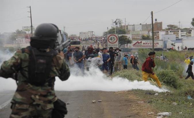 Police repress agricultural workers during a protest in Viru, Peru, Dec. 29, 2020.