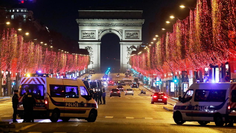 The Champs-Élysées avenue after celebrations and gatherings were banned in Paris, France, Dec. 31, 2020.