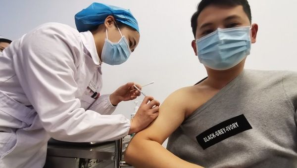 Nurse injects COVID-19 vaccine to a person working in high-risk in Bozhou, China, Jan. 4, 2021.