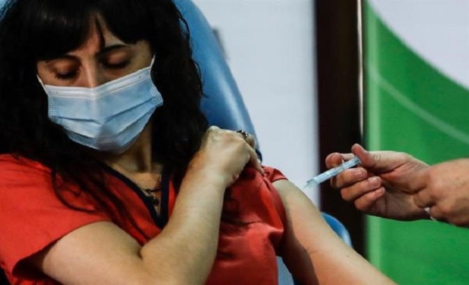 A woman is vaccinated with the Russian vaccine Sputnik V in Buenos Aires, Argentina, Jan. 1, 2020.