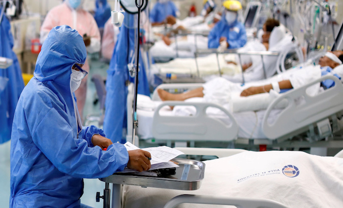 A health worker checks COVID-19 patients, Lima, Peru, Jan. 1, 2020.