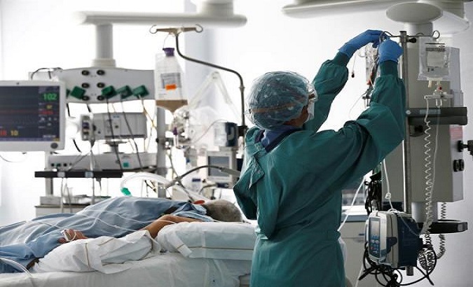 A nurse assists COVID-19 patients, Lima, Peru, Jan.13, 2021.