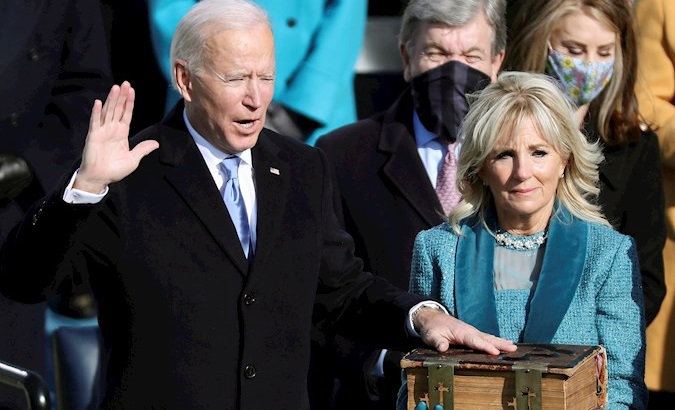 Joe Biden (L) and Jill Biden (C) during the inaugural ceremony, Washington, DC, U.S., Jan. 20, 2021.