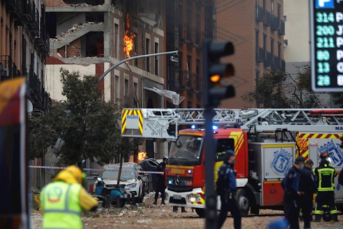 Firefighters, Police and emergency teams work on Toledo Street in Madrid, where at least 3 people have died after the explosion that caused the collapse of part of a building in six floors in the center of Madrid