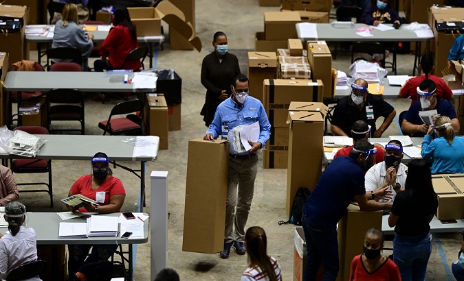 Electoral officials count votes, San Juan, Puerto Rico, 2020.
