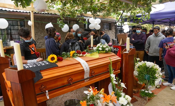 People gather next to Francisco Martinez's coffin, Santiago, Chile, Feb. 7, 2021.