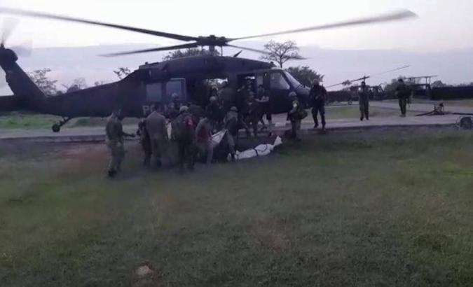 Military forces board Nelson Hurtado's body to a helicopter, Choco, Colombia, Feb. 7, 2021.