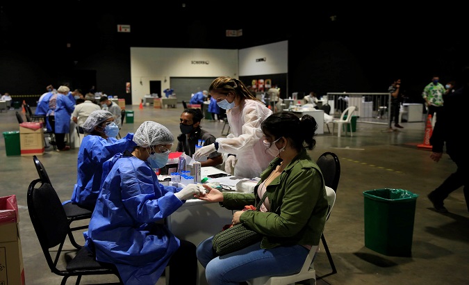 Health workers carry out COVID-19 tests on teachers, Buenos Aires, Argentina, Feb. 9, 2021.