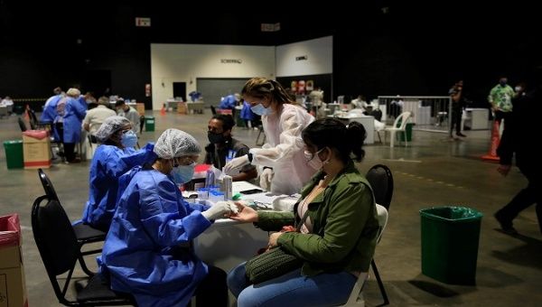 Health workers carry out COVID-19 tests on teachers, Buenos Aires, Argentina, Feb. 9, 2021.