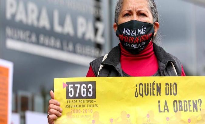 A woman protests against extrajudicial killings, Bogota, Colombia, 2021.