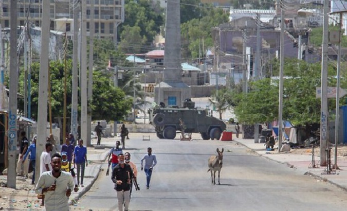 Image of people walking away from a conflict zone, Mogadishu, Somalia, Feb. 19, 2021.