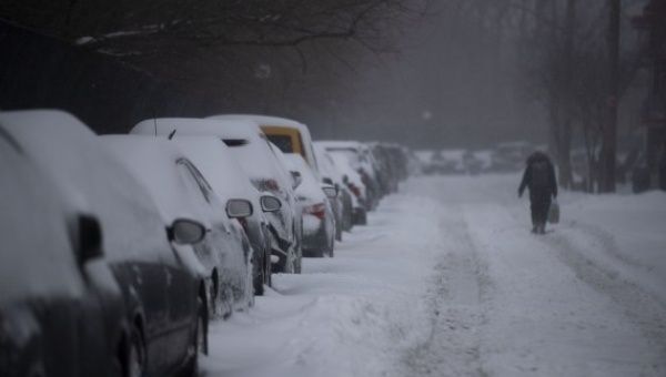Vehicles are seen covered with snow in New York, the United States, on Feb. 1, 2021. 