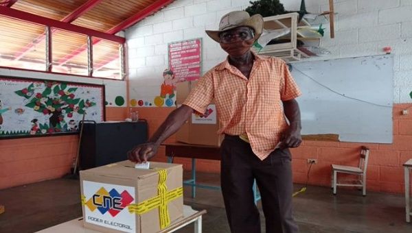 A man casts his vote, Venezuela, Dec. 6, 2020.