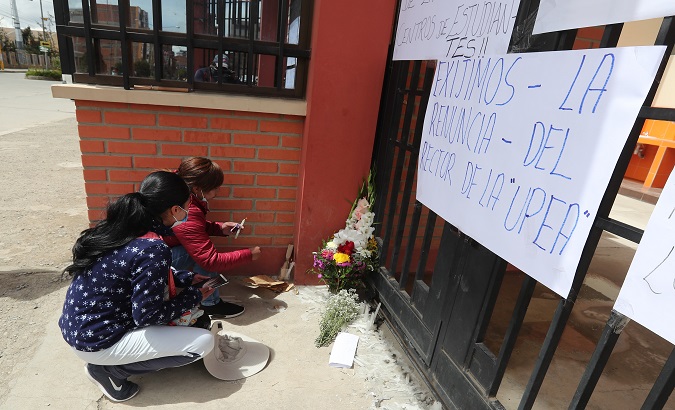 Students place candles at the El Alto University, Bolivia, March 3, 2021.
