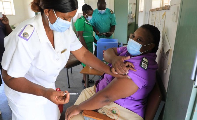 A woman gets a jab of Sinopharm vaccine at a hospital in Gokwe, Zimbabwe, Feb. 22, 2021.
