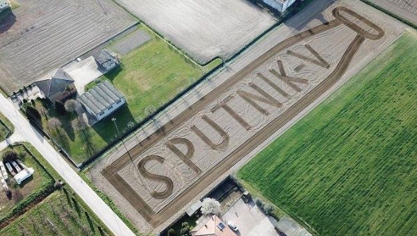 Italian land artist Dario Gambarin makes a 13 000 m2 Sputnik V vaccine flask image in a field in Northern Italy.