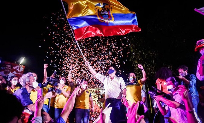Andres Arauz waves a flag of Ecuador, March 22, 2021.