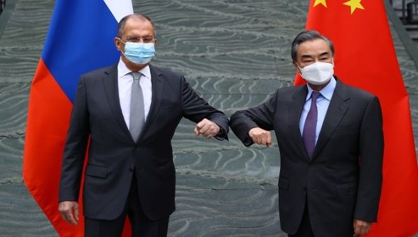Russia's Foreign Affairs Ministry Sergey Lavrov (L) and China's Foreign Minister Wang Yi (R), Guilin, China, March 22, 2021.