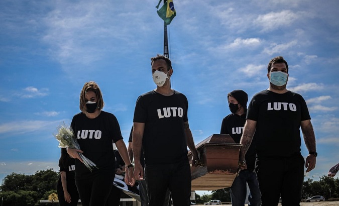 Health professionals protested in Brasilia to denounce the death of 300 thousand citizens from COVID-19 in Brazil, March 25, 2021.