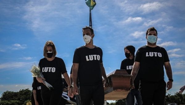 Health professionals protested in Brasilia to denounce the death of 300 thousand citizens from COVID-19 in Brazil, March 25, 2021. 
