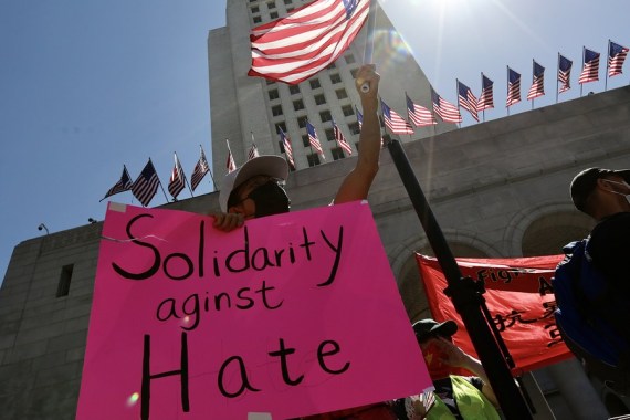 People participate in a Stop Asian Hate rally and march in response to the rising violence against Asian American communities at Los Angeles City Hall, California, the United States March 27, 2021.