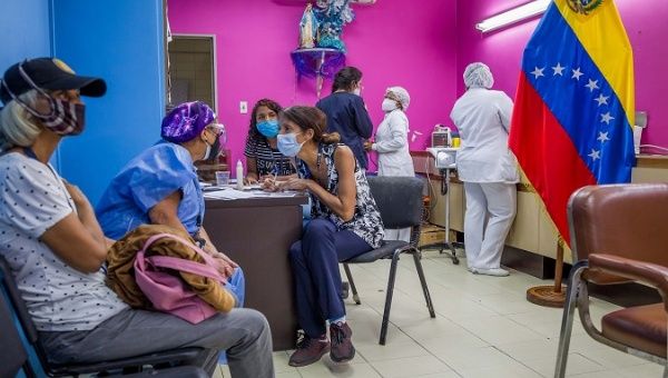 Health workers vaccinate citizens, Caracas, Venezuela, Feb. 22, 2021.