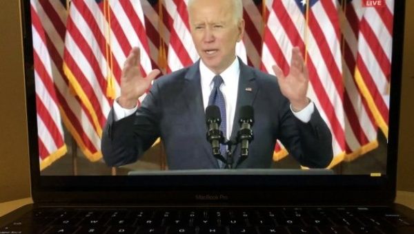 Photo taken in Arlington, Virginia, the United States, on March 31, 2021 shows a screen displaying U.S. President Joe Biden delivering a speech in Pittsburgh, Pennsylvania in a live stream provided by CNBC.