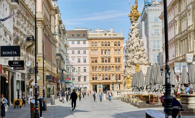 People walk on a street in downtown Vienna, Austria, on April 1, 2021.