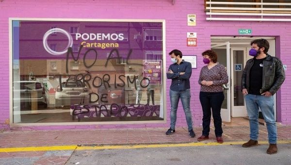 Podemos supporters in front of the party's headquarters in Cartagena, Spain, March 2, 2021.