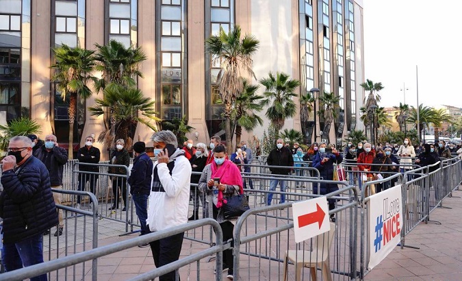 People line up to receive the COVID-19 vaccine in Nice, France, April 10, 2021.
