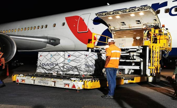 Airport workers unload batch of Sputnik V vaccines, Maiquetia, Venezuela, April 15, 2021.