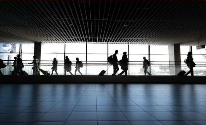 Travelers walk through Mexico City's international airport, Mexico, April 2021.