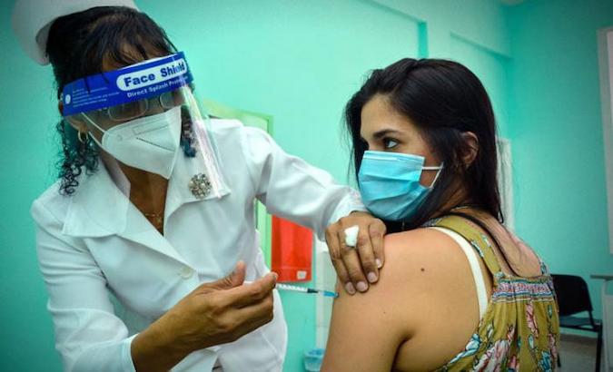 A health worker vaccinates a citizen in Havana, Cuba, May 2021.