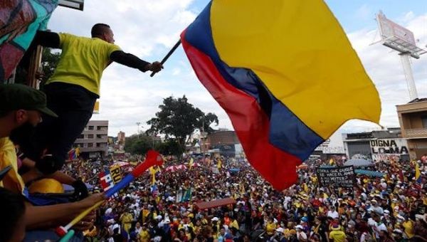 A man waves a Colombian flag during a protest in Cali, Colombia, May 19, 2021.
