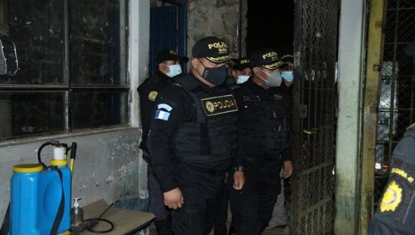 Police officers remain at the Cantel Rehabilitation Farm, Quetzaltenango, Guatemala, May. 20, 2021. 