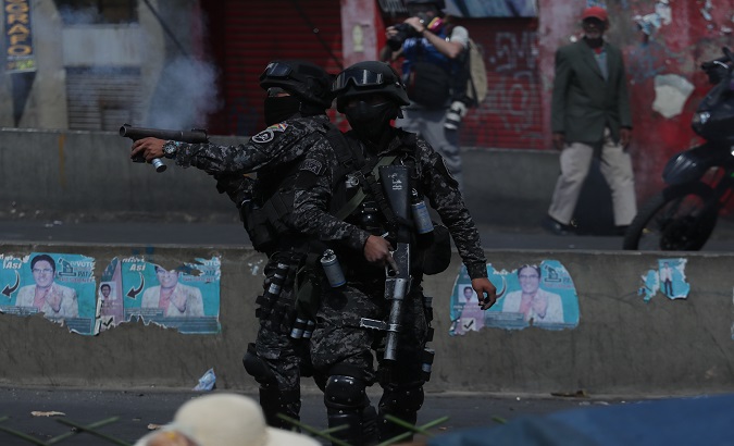 Police officers fire tear gas at protesters, La Paz, Bolivia, Nov. 21, 2019.