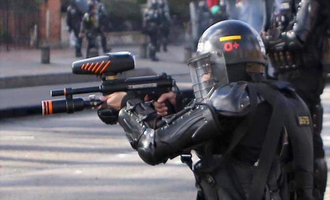 A Mobile Anti-Riot Squad agent targets protesters in Bogota, Colombia, May 2021.