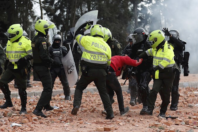 Members of the Mobile Anti-Riot Squad (ESMAD) detain a protester during a day of protests today, in Madrid, a nearby municipality of Bogotá (Colombia)