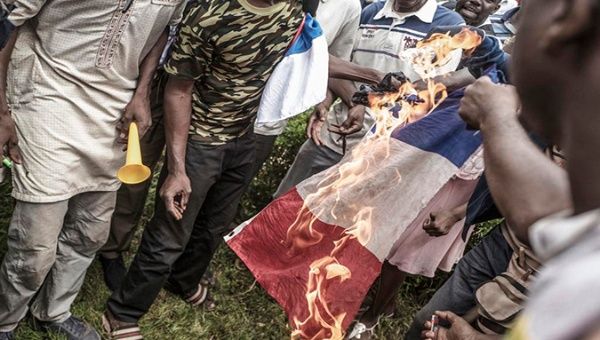 Malians burning the French flag Sunday in Bamako