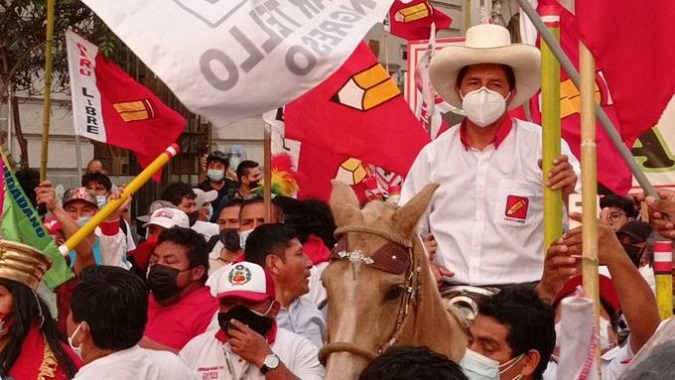 Progressive Peruvian presidential candidate Pedro Castillo riding a horse during a political rally.