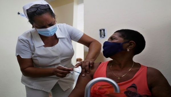 A nurse shoots a citizen with the Cuban COVID-19 vaccine Abdala in Matanzas, Cuba, July 22, 2021.