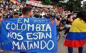 Sign reads, "We are being killed", Cali, Colombia, June 13, 2021
