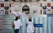 Doctors raise protest banners, Madrid, Spain, Jan. 12, 2023.