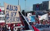 The banner reads, "Down with the Helms-Burton Act," Havana, Cuba. 