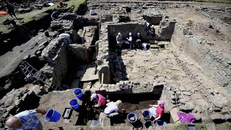 Archaeologists work on a recently discovered Roman Bath house dating back 1800 years at Binchester, northern England July 24, 2014. REUTERS/Nigel Roddis