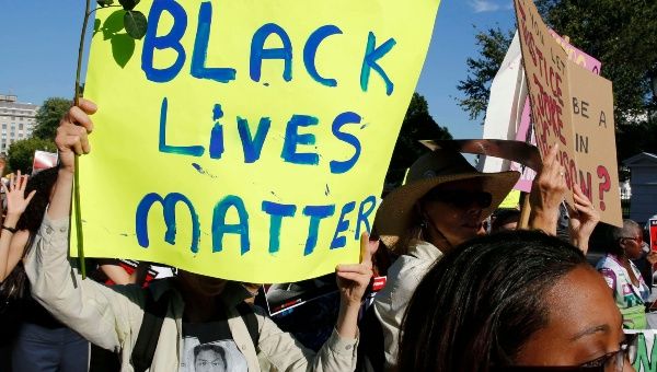 Protesters march in front of the White House in Washington D.C. on August 28. 900,000 signatures were turned in demanding a thorough investigation into Michael Brown's murder (Photo: Reuters).