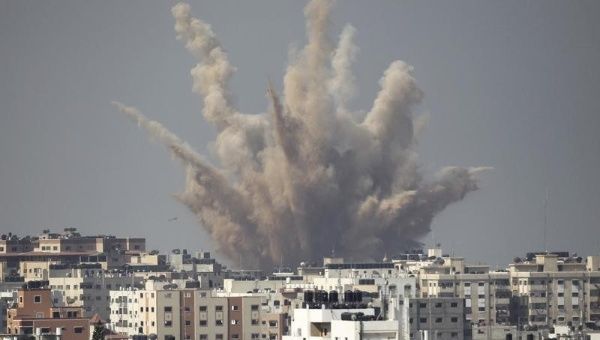 Smoke and sand are seen following what witnesses said was an Israeli airstrike in Gaza Aug. 25, 2014.