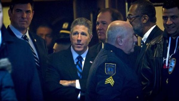 Patrick Lynch (C), president of the city's Patrolmen's Benevolent Association, attends slain New York Police Department officer Wenjian Liu's wake in Brooklyn, New York January 3, 2015